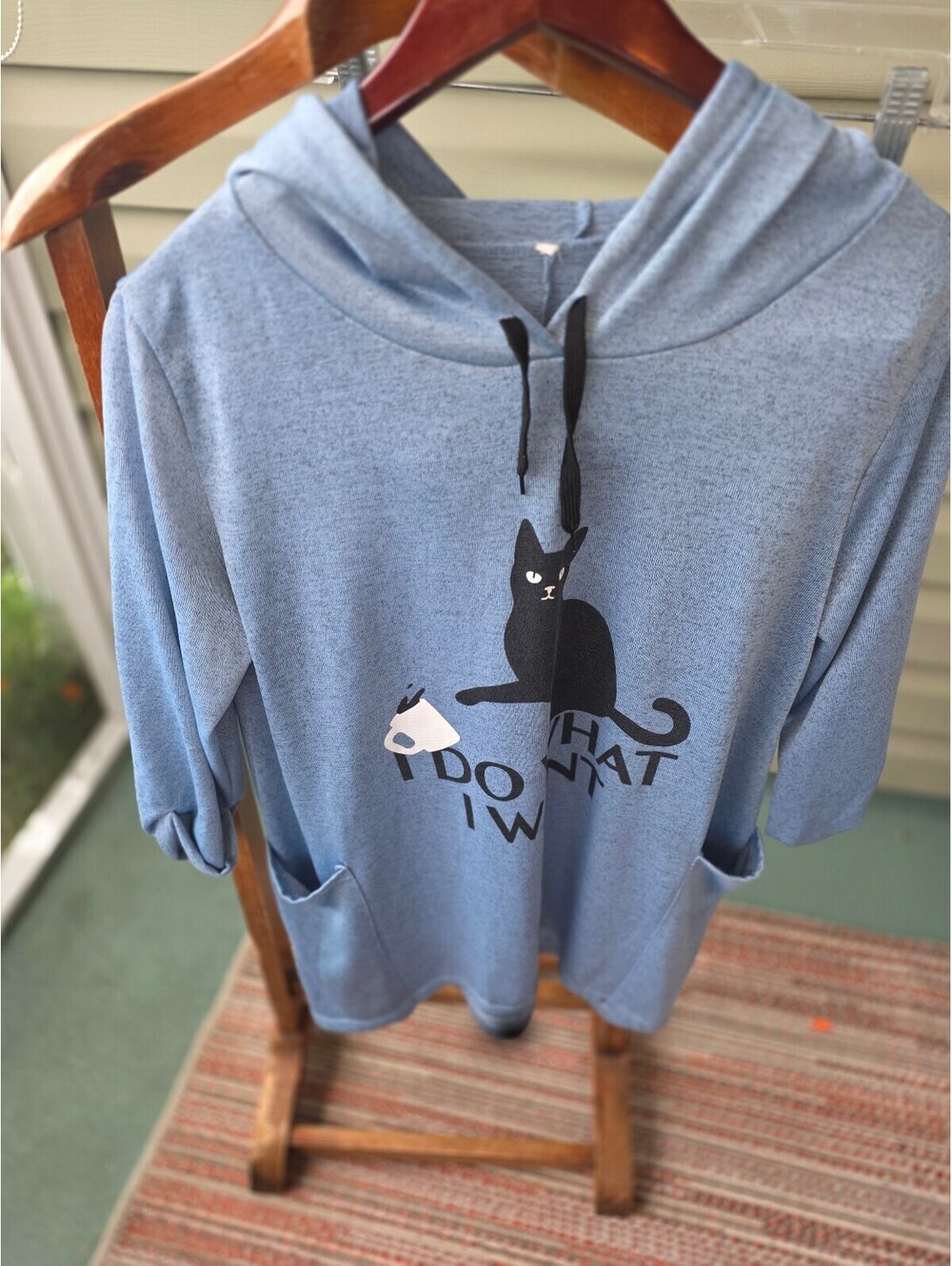 Light Blue Hoodie with Playful Cat Print and Front Pockets